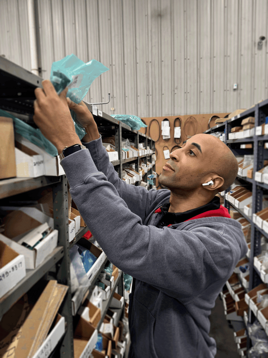 Delta Diesel Parts employee stocking parts.